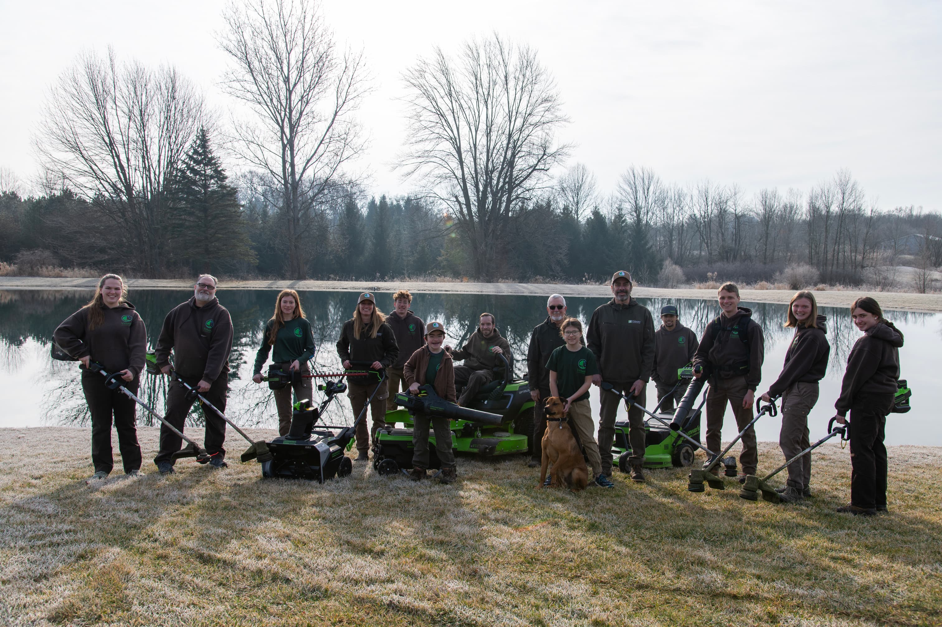 Virtuoso Landscaping team holding electric equipment